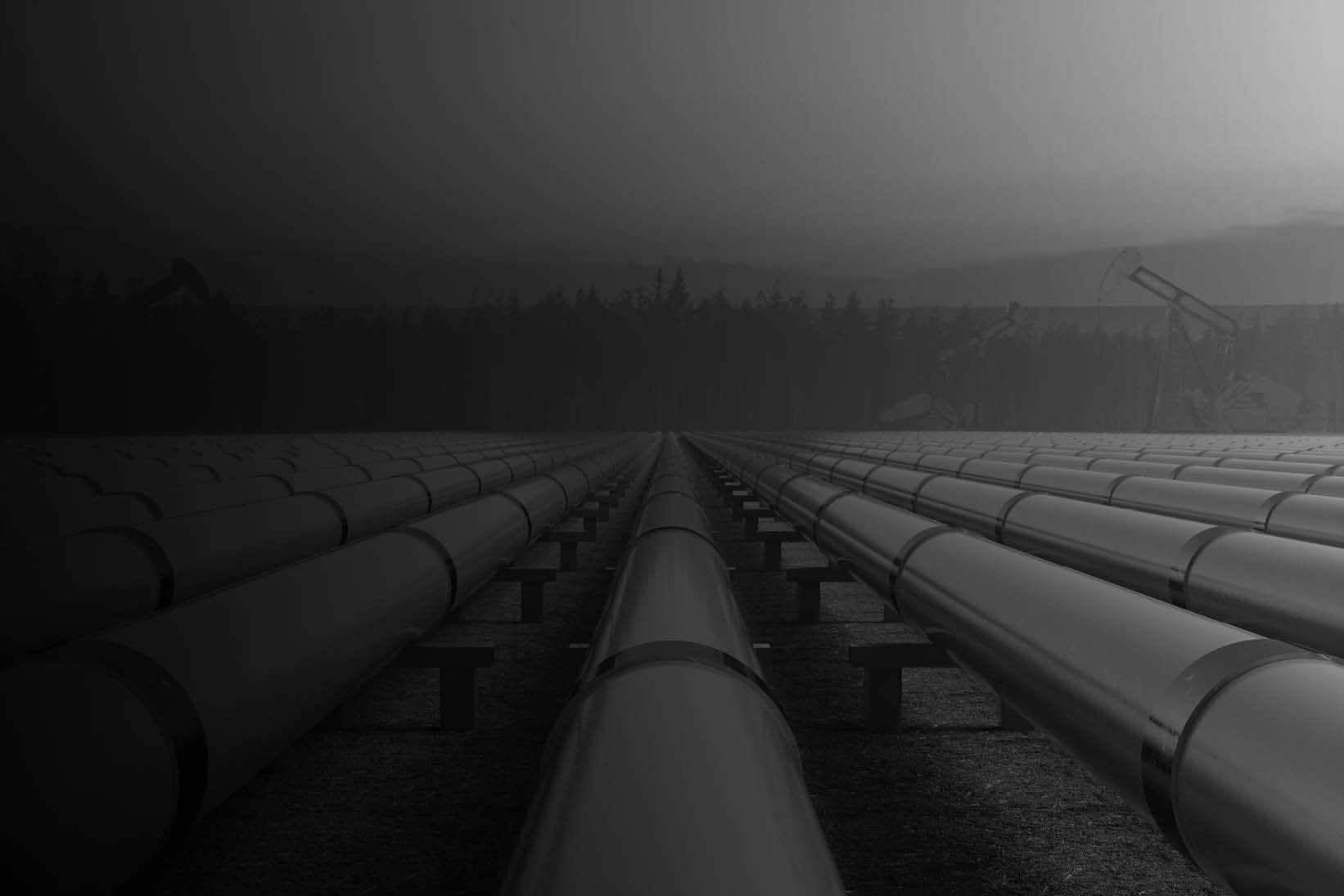 Industrial energy pipelines extending toward the horizon, symbolizing energy infrastructure, operational resilience, and the transition to a sustainable energy future - used on Capco Energy