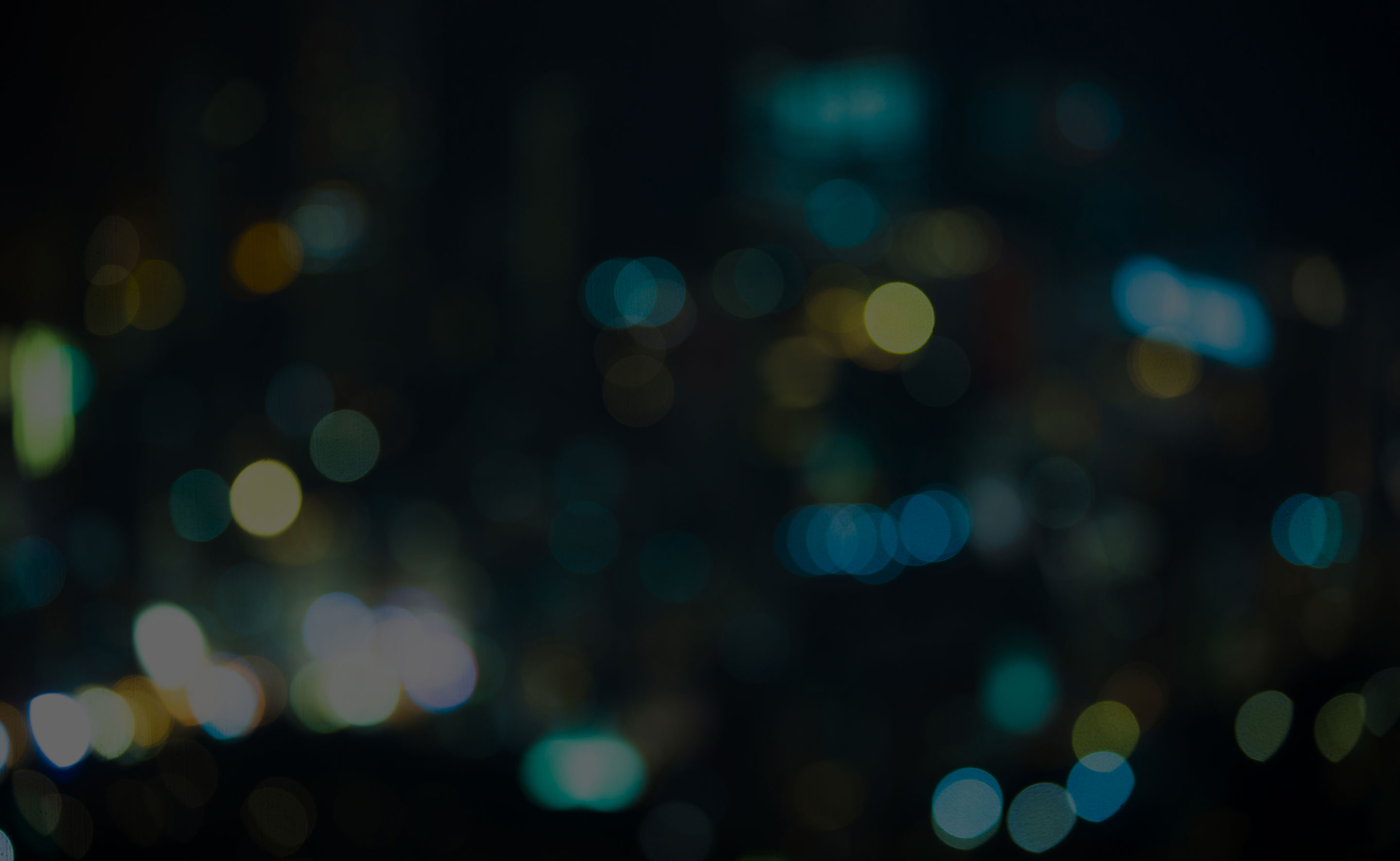 Street lights of urban city street at night.