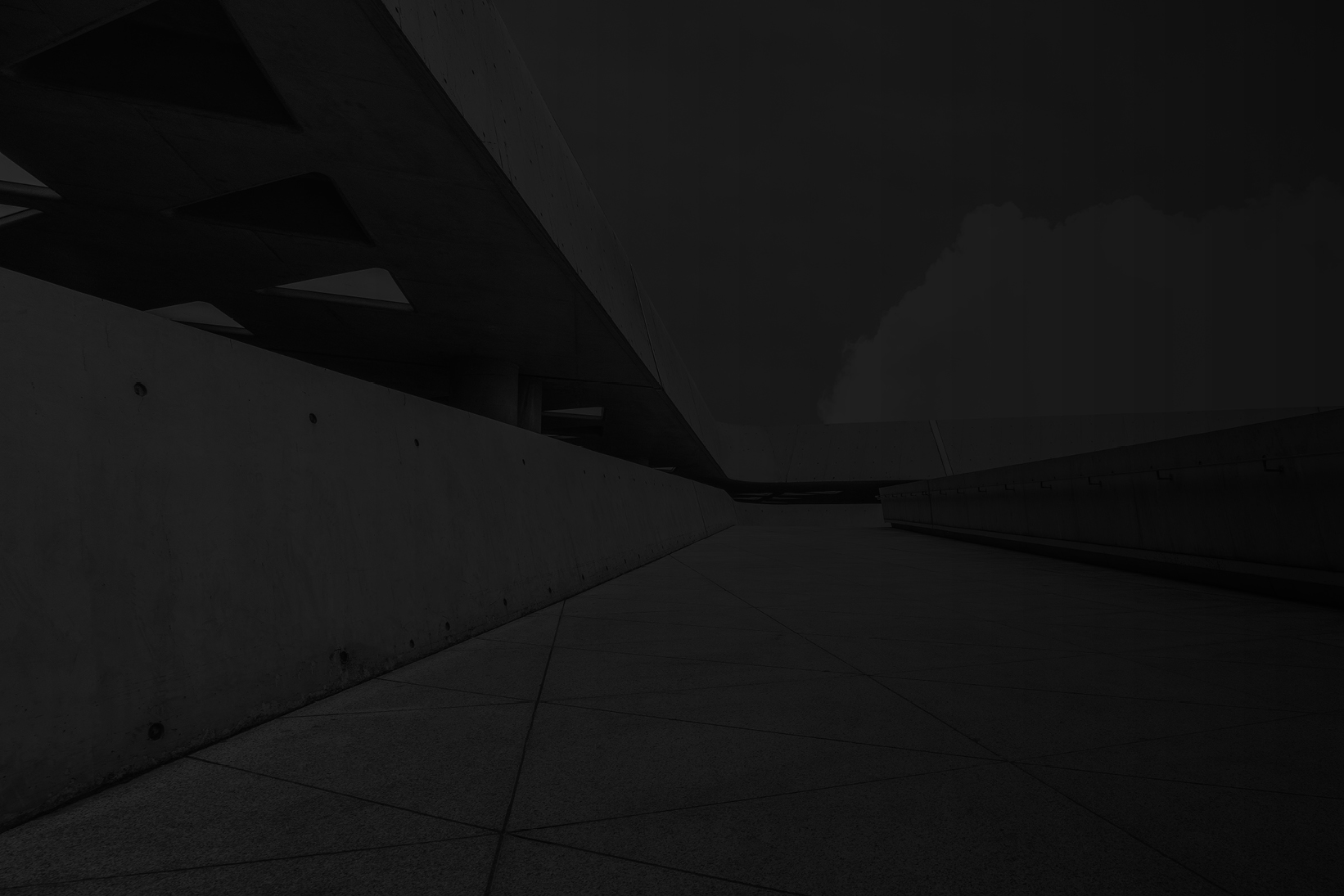 Modern concrete architectural walkway with clean geometric lines and minimalist design.